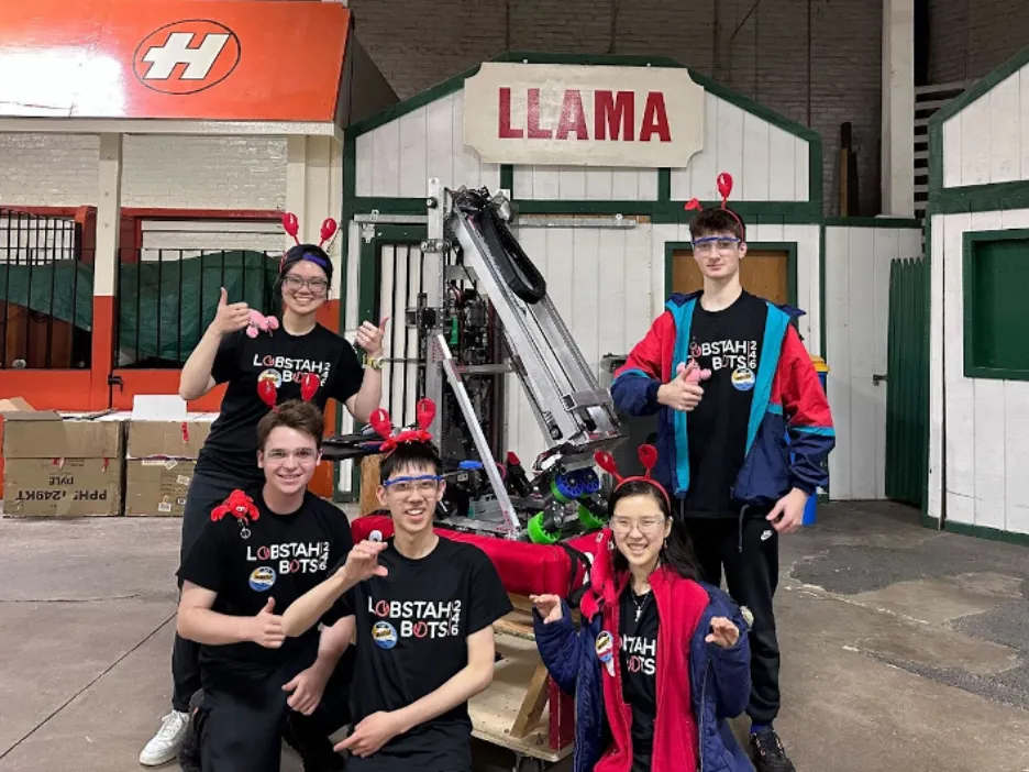 Veronica (Mentor), George '24, Maxwell '25, Kendree '25, and Owen '25 posed for a photo with our robot by the Llama sign. Our robot this year was named “Llama," so this photo was rather fitting.