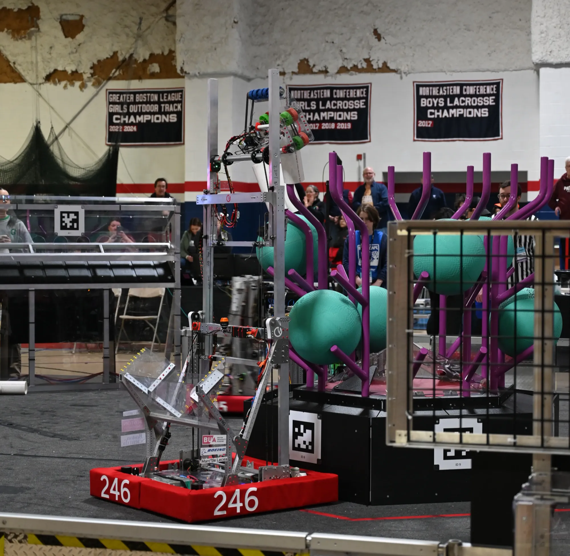 Our robot, Beluga, scoring a Coral on the Reef at the Greater Boston event